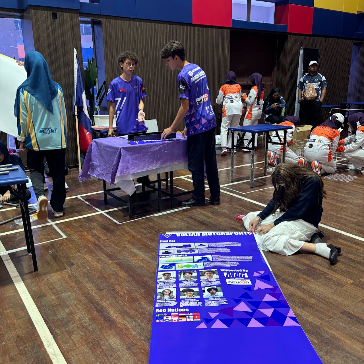Setting up the pit display and presentation materials